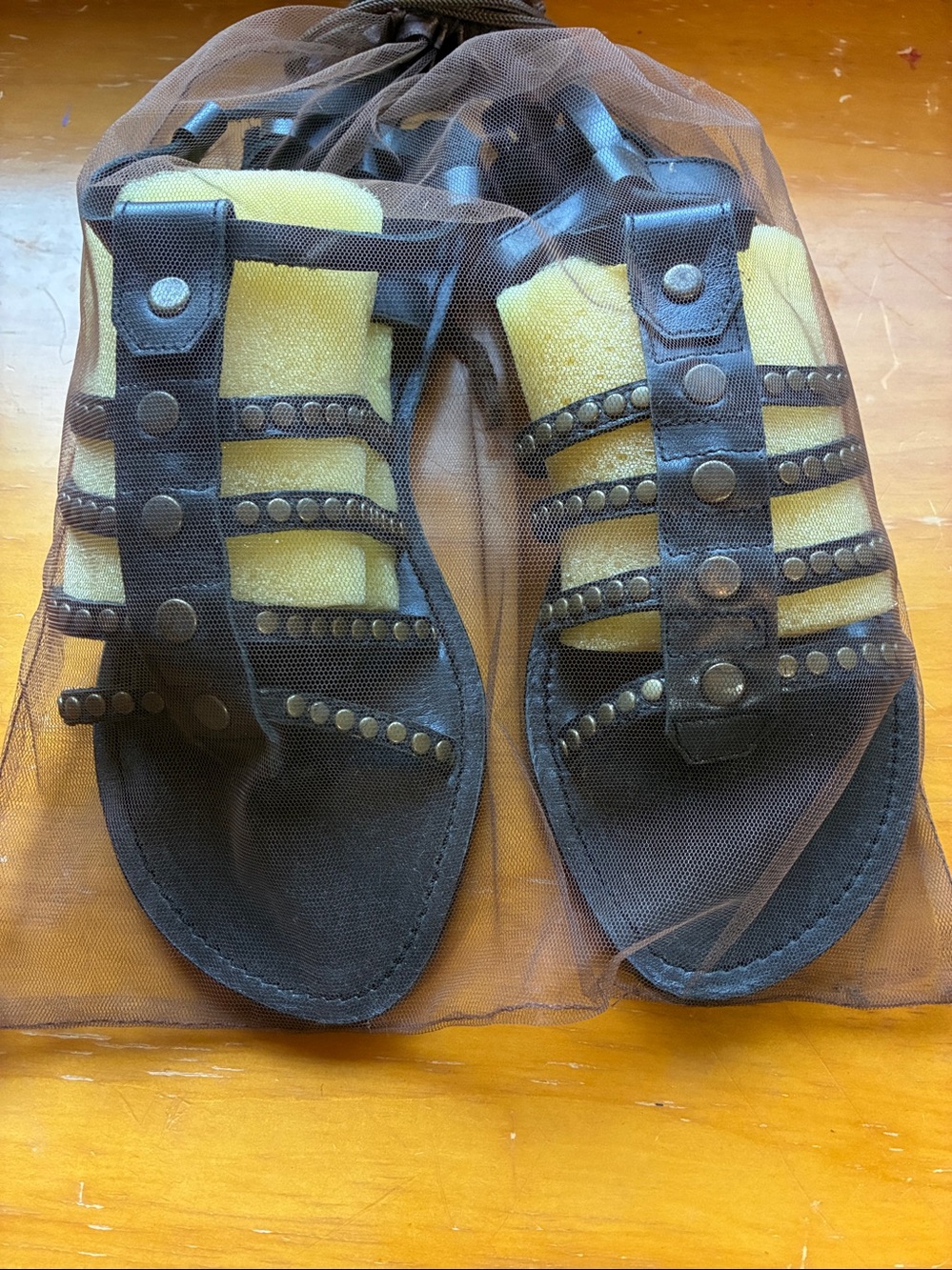 Mystique Black gladiator sandals with faux studs on straps.